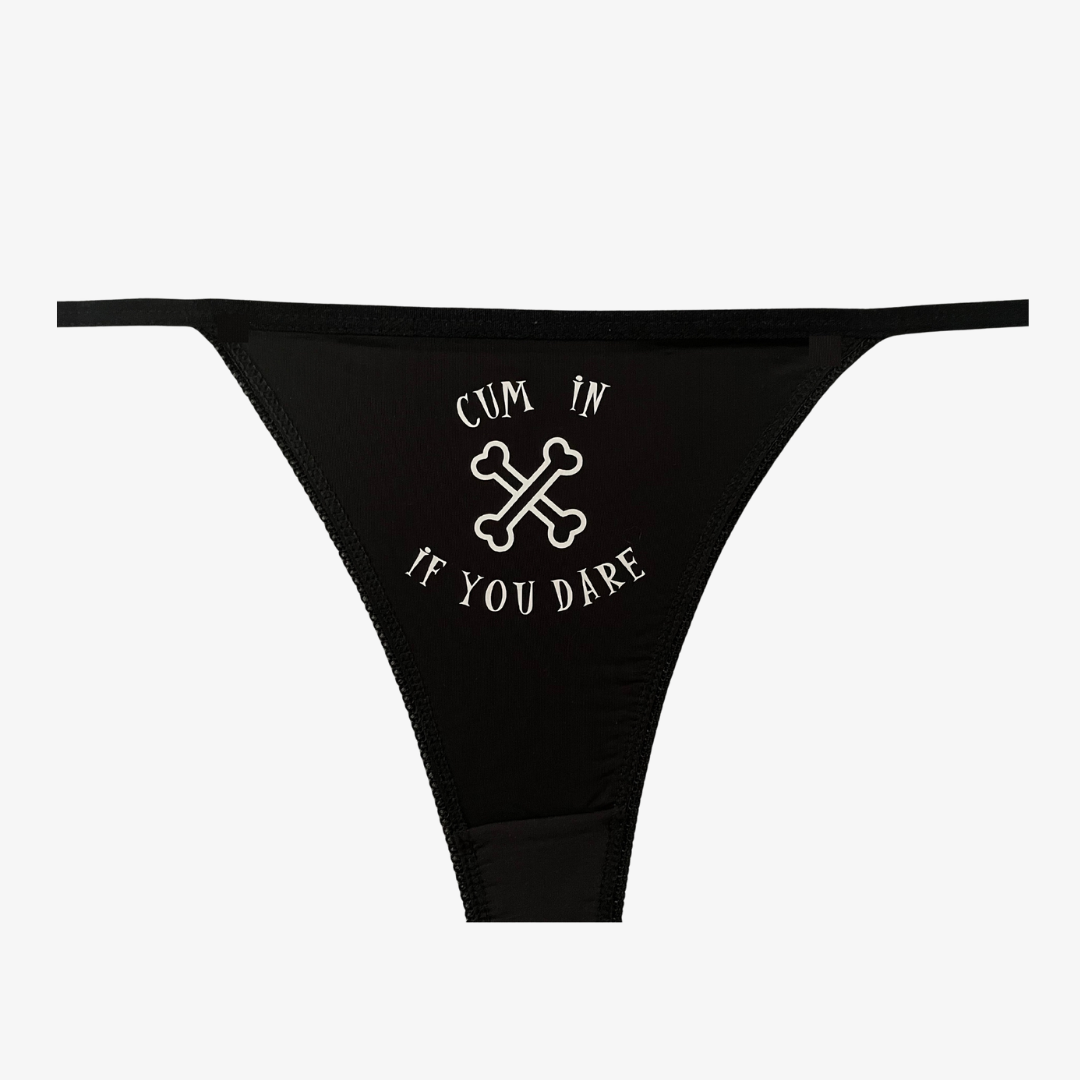 a black bikini bottom with a cross on it