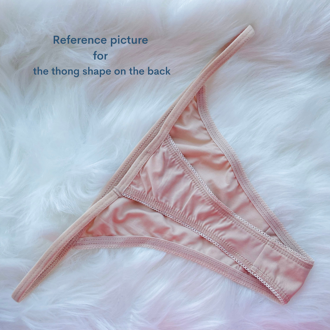 a pink bra with the words reference picture for the thong shape on the back