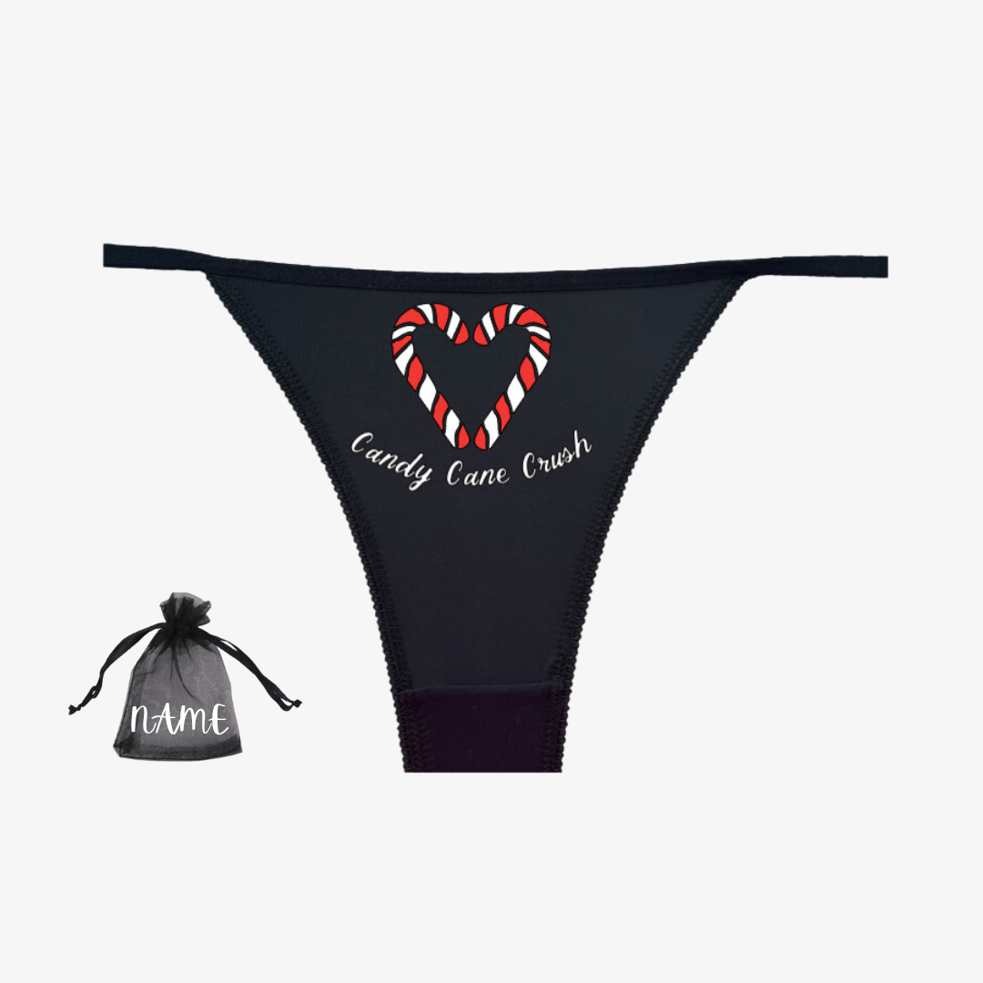 a black bikini with a candy cane heart on it