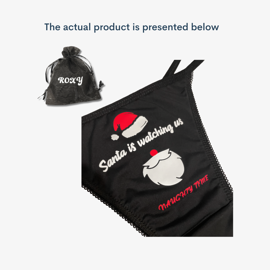 a black bag with a santa hat on top of it