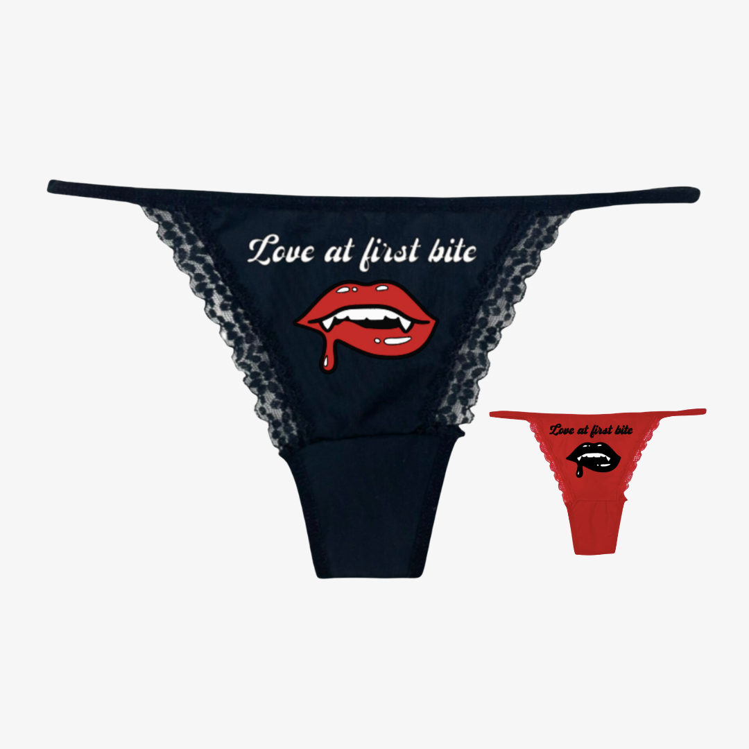 a women's panties with the words love at first bite on it